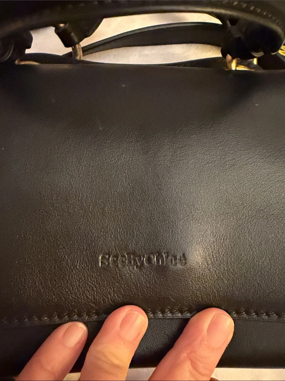 Black Satchel Handbag with Woven Edge and Gold Charm